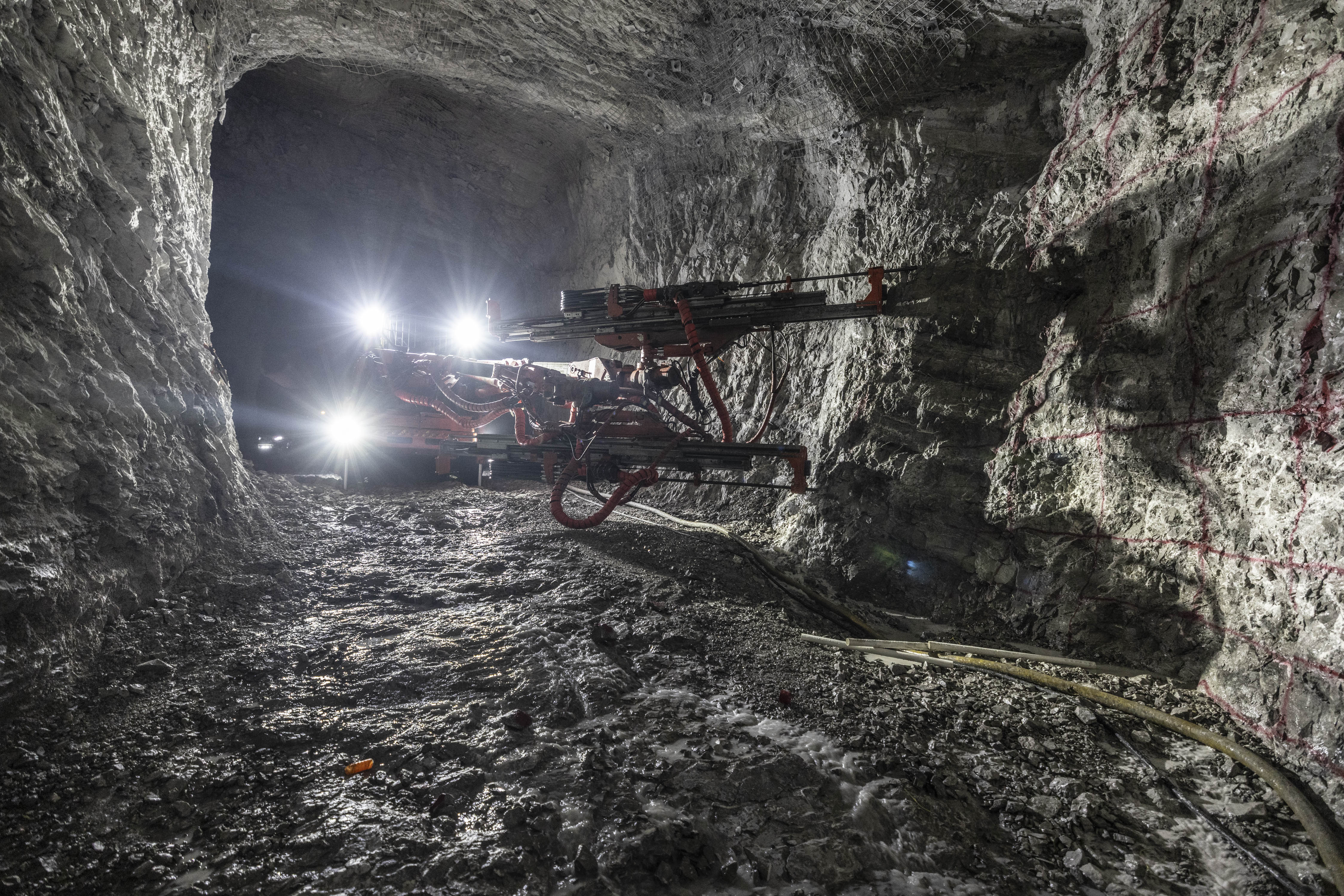 Underground mine development drill rig on an active mining site