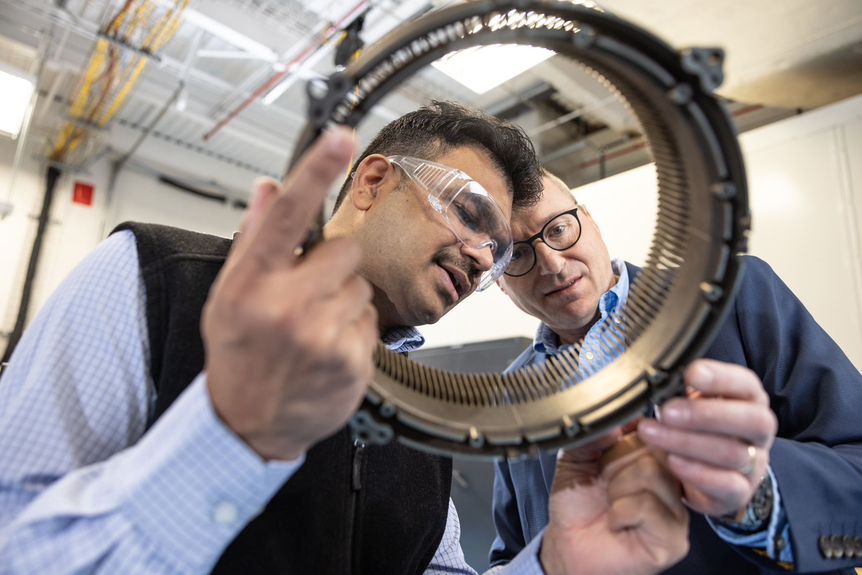 Precision engineering discussion at an aerospace manufacturing facility